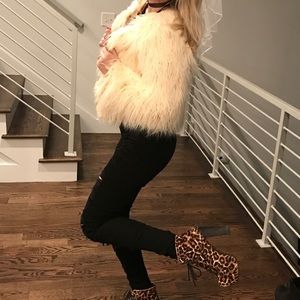White faux fur coat